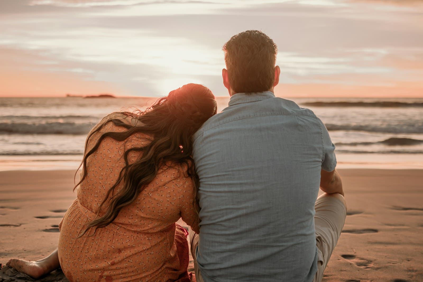 Couple on the beach at sunset