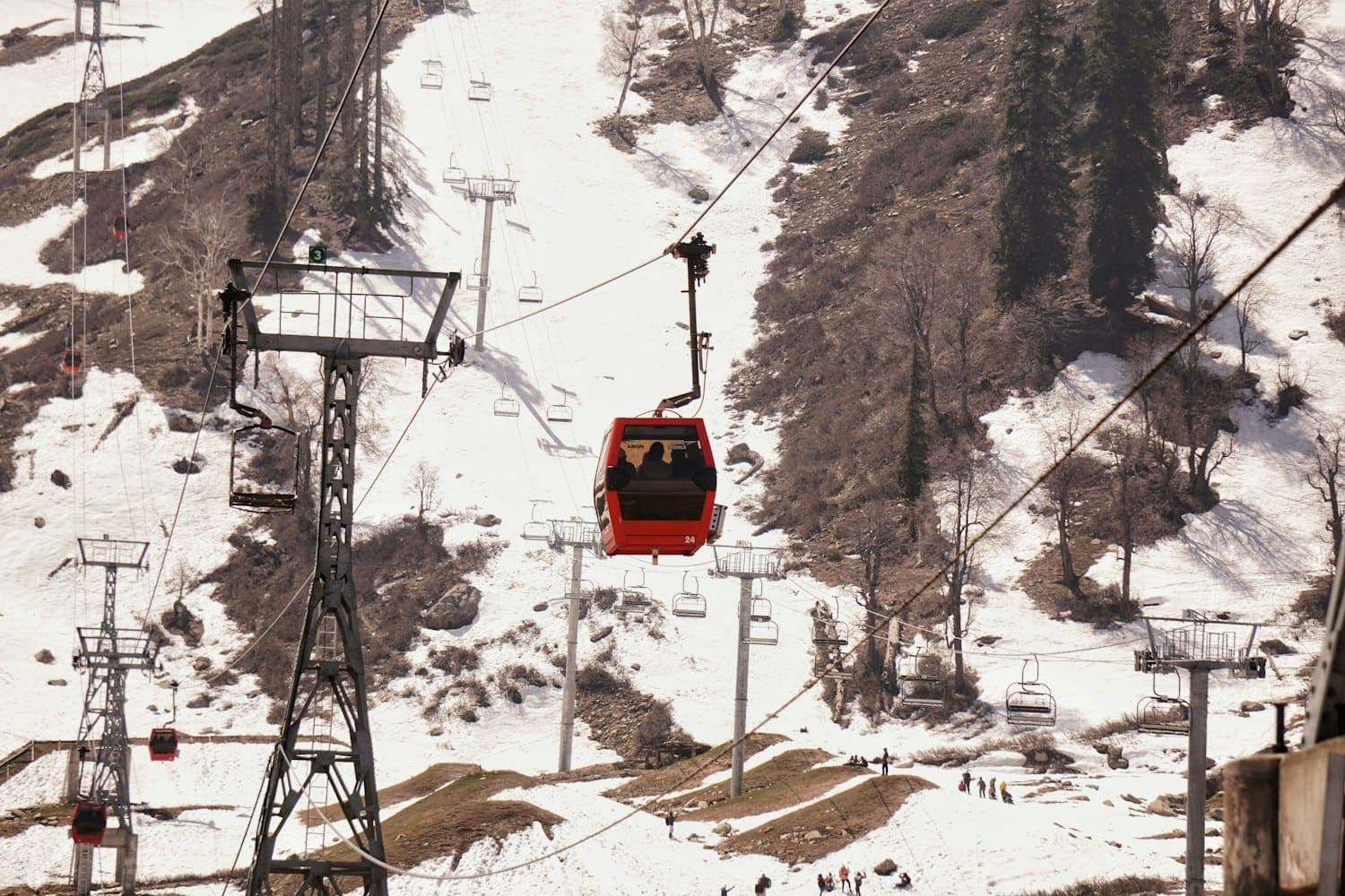 The Gulmarg gondola over snow-covered slopes