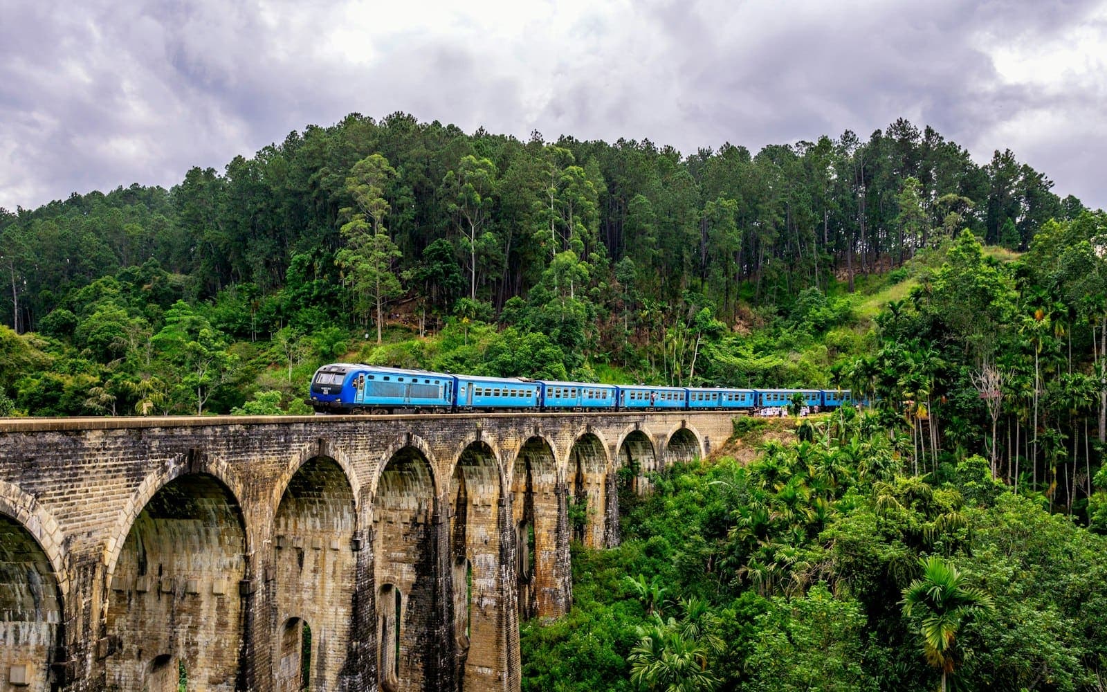 Blue train on the Nine Arches Bridge, Sri Lanka